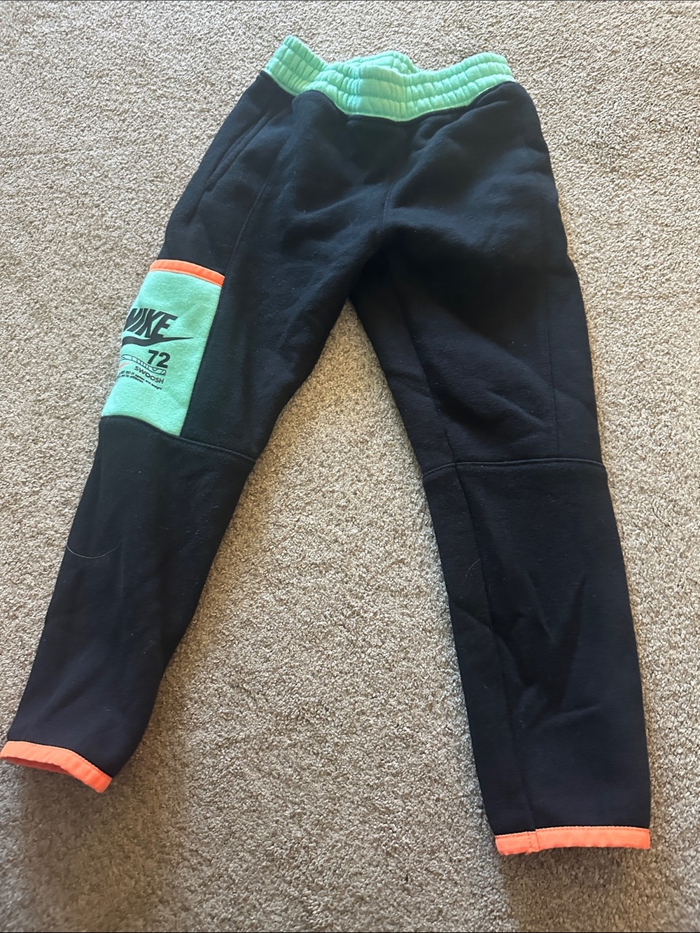 Nike Kids Black Joggers with Mint Waistband and Orange Hem Accents size 5
